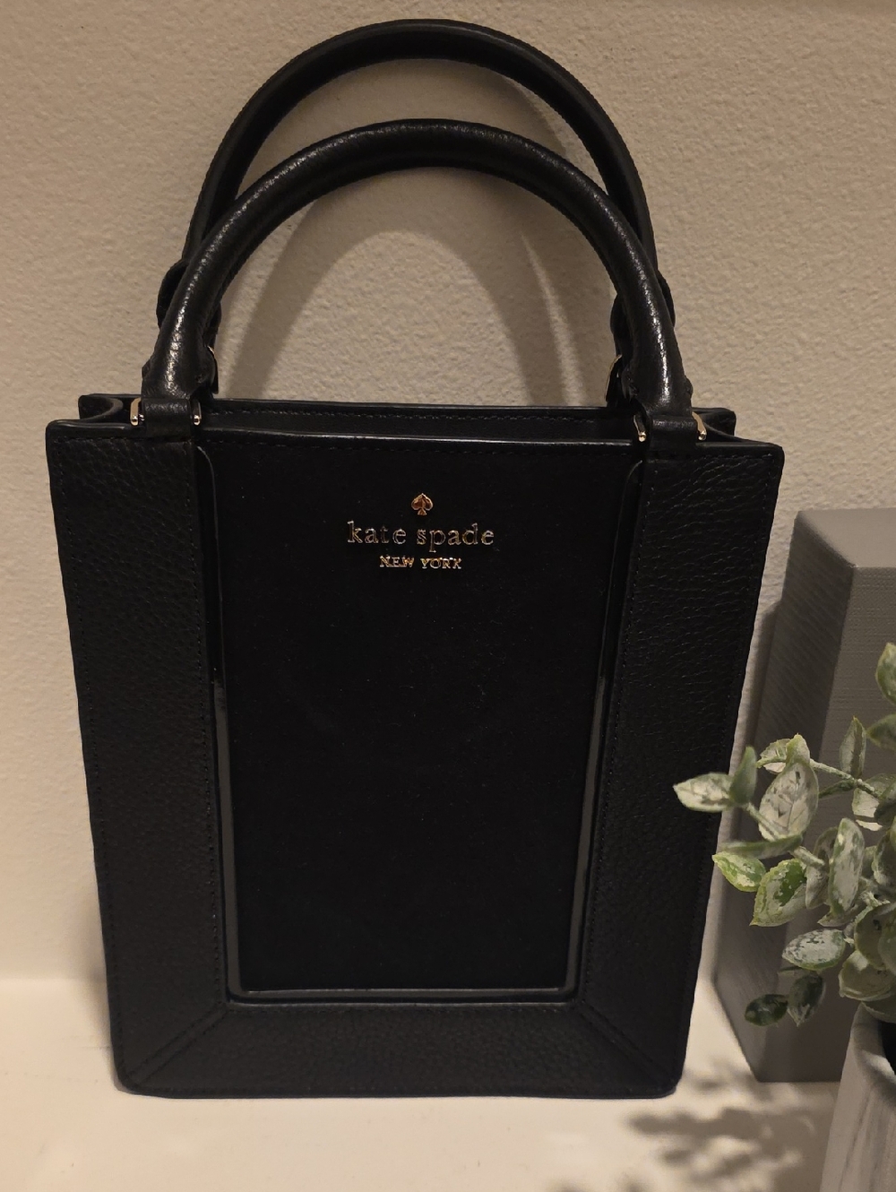 kate spade black leather satchel with gold logo